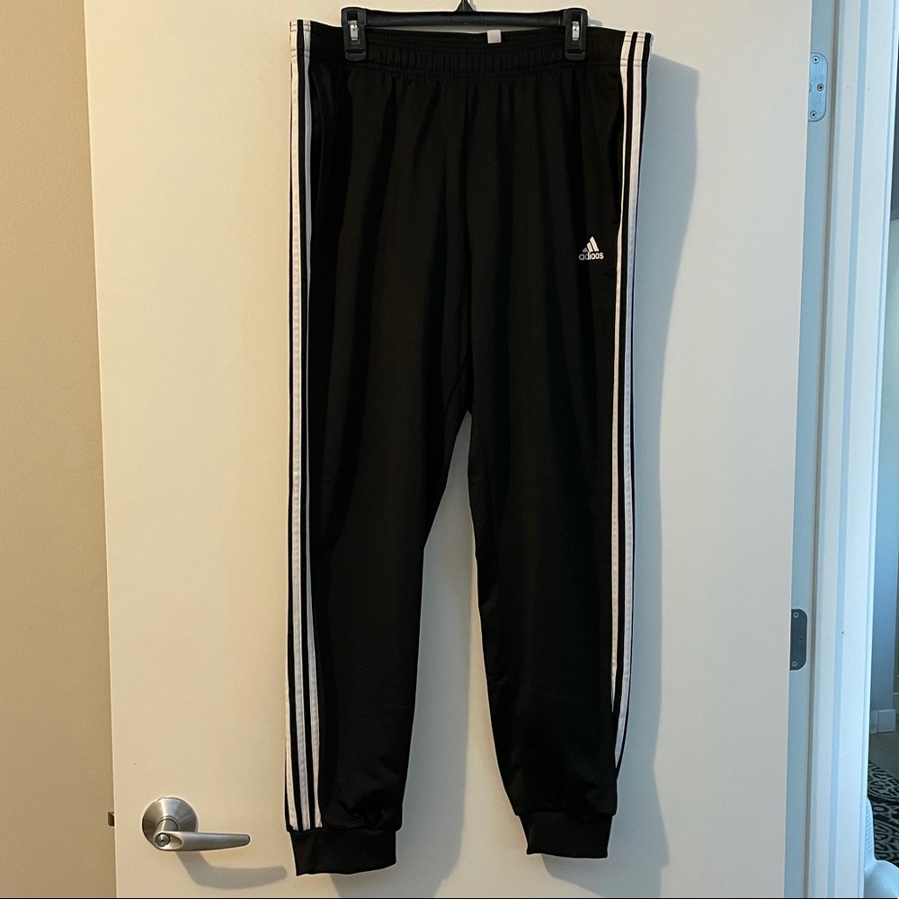 Black with white stripes Adidas Track Bottoms in size XL